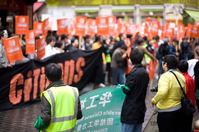 Hundreds of people gather in Chinatown's Gerrard Street to  show their solidarity